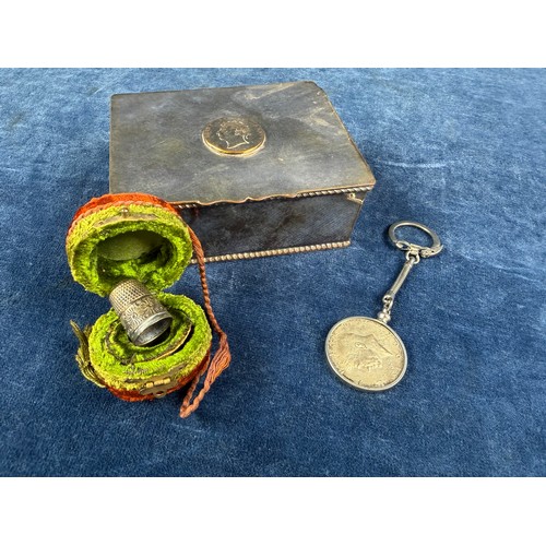 174 - A small collection of interesting items, comprising; a metal thimble in case, a USA half dollar moun... 