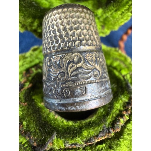 174 - A small collection of interesting items, comprising; a metal thimble in case, a USA half dollar moun... 