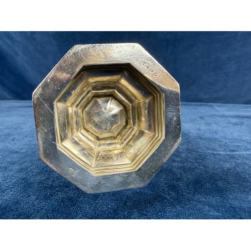 100 - A silver sugar shaker of plain design and pierced top, hallmarked London 1933-1934, makers mark J. W... 