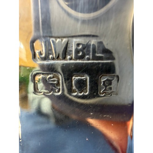 100 - A silver sugar shaker of plain design and pierced top, hallmarked London 1933-1934, makers mark J. W... 