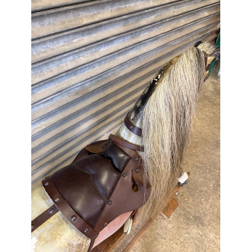 19 - An antique rocking horse with dapple grey colouring and horse hair mane and tail on pitched pine bas... 