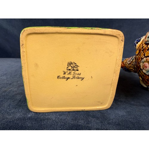 211 - A W. H. Goss pottery jug in the design of a cottage together with an alrambrian vase, with brown and... 