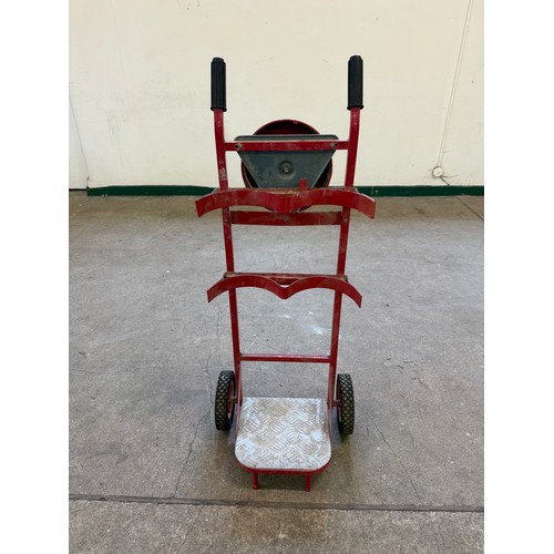 16 - A vintage set of sack wheels with a mounted fire bell on reverse.