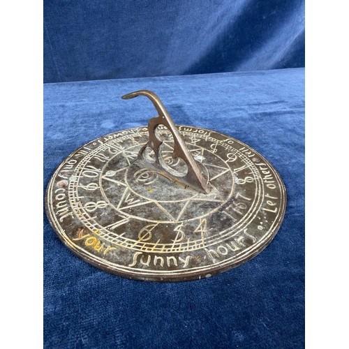 372 - An antique bronze sun dial. Width 18cm approximately.