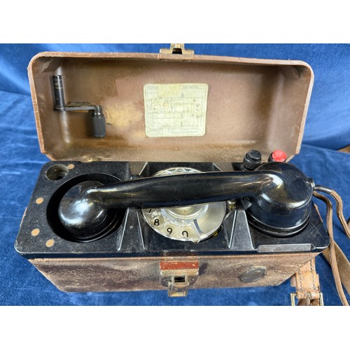 380 - A vintage bakelite field telephone.
