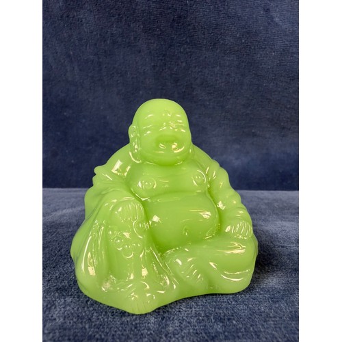 219 - Three pieces of jade depicting a buddha, a bird and an elephant.