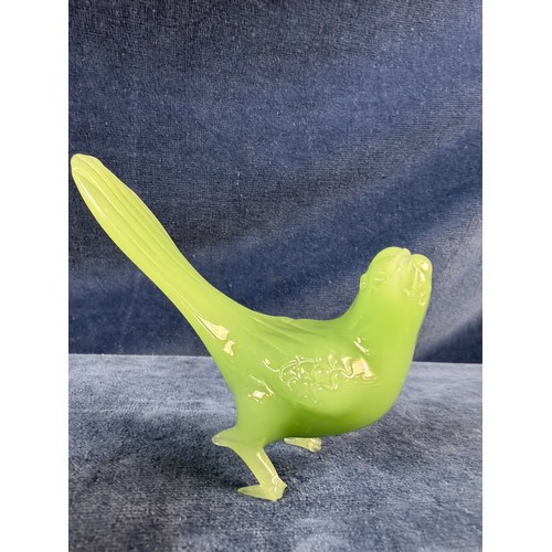 219 - Three pieces of jade depicting a buddha, a bird and an elephant.