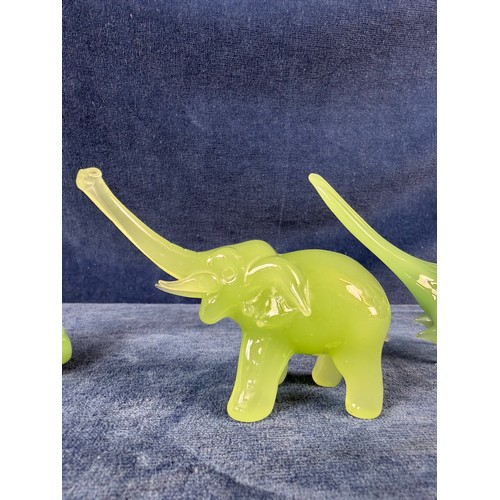 219 - Three pieces of jade depicting a buddha, a bird and an elephant.