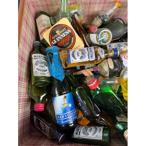 387 - A small suitcase containing a quantity of alcoholic miniatures, including; drambuie, martini, schwep... 