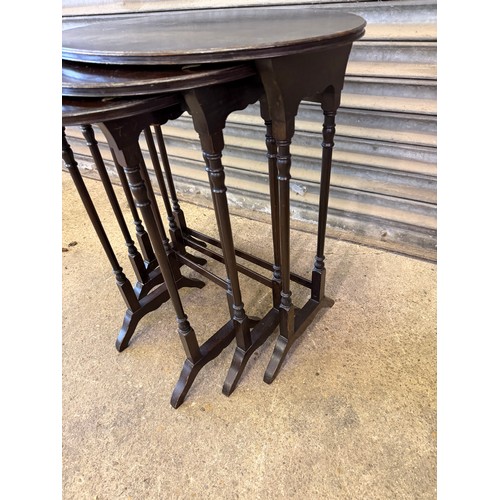 462 - An antique nest of 3 tables on shaped legs.