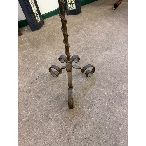 458 - An antique cast iron standard lamp with adjustable height section with shade.