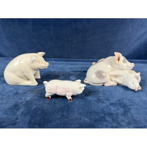 220 - A collection of 5 china pig ornaments being Beswick, Lladro, Royal Copenhagen, Belleek - floral trea... 