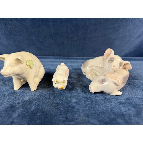220 - A collection of 5 china pig ornaments being Beswick, Lladro, Royal Copenhagen, Belleek - floral trea... 