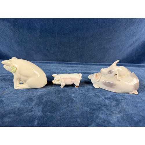 220 - A collection of 5 china pig ornaments being Beswick, Lladro, Royal Copenhagen, Belleek - floral trea... 