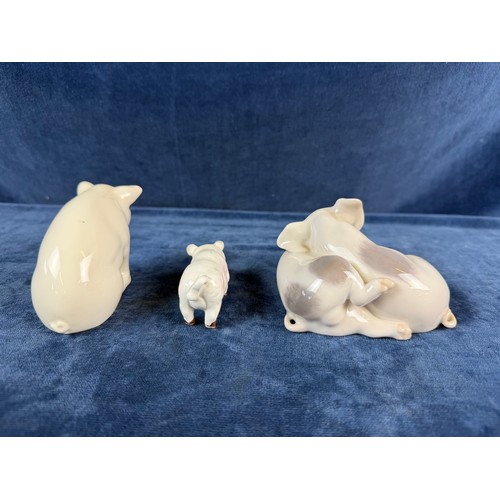 220 - A collection of 5 china pig ornaments being Beswick, Lladro, Royal Copenhagen, Belleek - floral trea... 