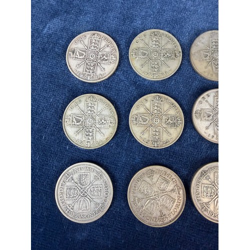 121 - A collection of 15 florin coins dated 1914, 1920, x3 1921, x2 1922, 1923, 1933, x2 1935, x3 1936 and... 
