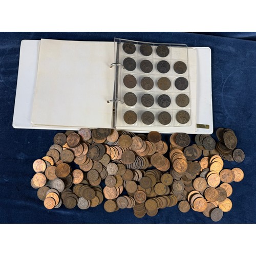 123 - An album containing a quantity of one penny and half penny coins, together with a large quantity of ... 