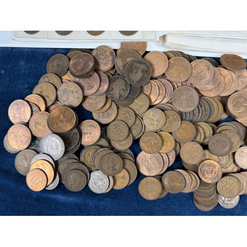 123 - An album containing a quantity of one penny and half penny coins, together with a large quantity of ... 