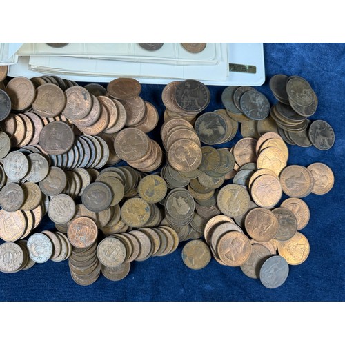123 - An album containing a quantity of one penny and half penny coins, together with a large quantity of ... 