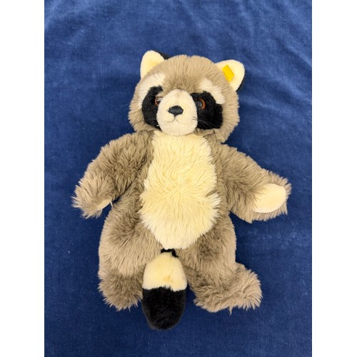 279 - A vintage Steiff soft toy/ teddy depicting a raccoon, having a metal 'Steiff' stud and label  attach... 