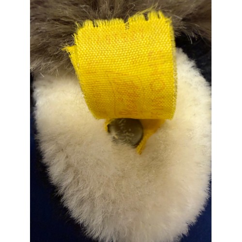 279 - A vintage Steiff soft toy/ teddy depicting a raccoon, having a metal 'Steiff' stud and label  attach... 