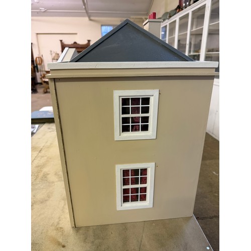 229 - A hand made dolls house, with 2 section opening front.