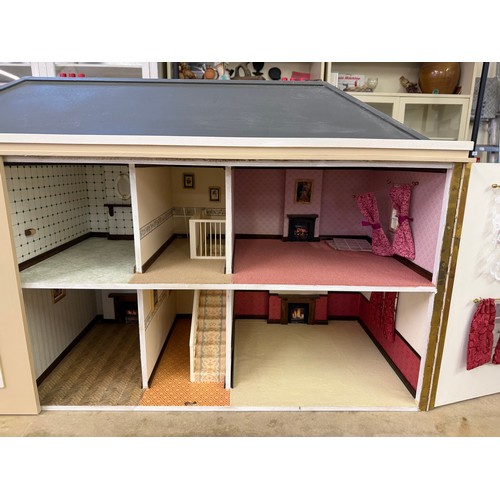 229 - A hand made dolls house, with 2 section opening front.