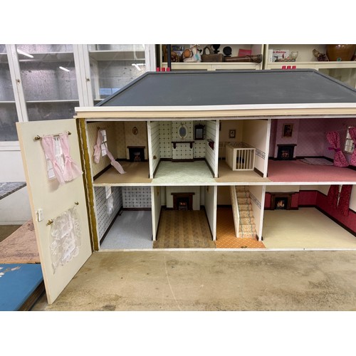229 - A hand made dolls house, with 2 section opening front.