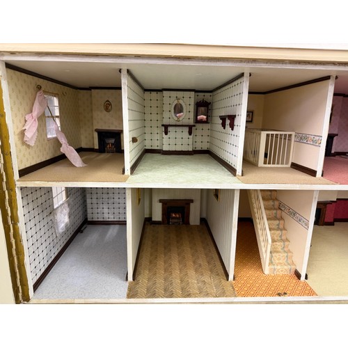 229 - A hand made dolls house, with 2 section opening front.