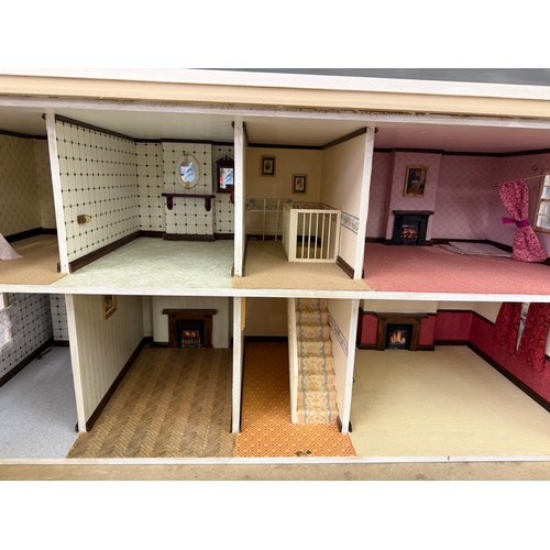 229 - A hand made dolls house, with 2 section opening front.