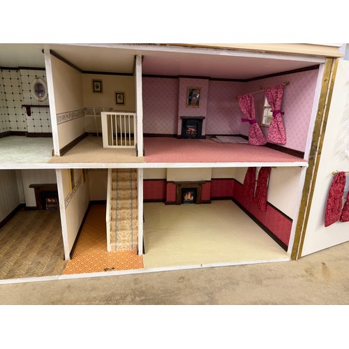 229 - A hand made dolls house, with 2 section opening front.