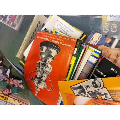 A box containing a large quantity of football programmes for various ...