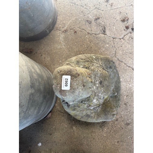 6062 - A concrete garden ornament of a Buddha.