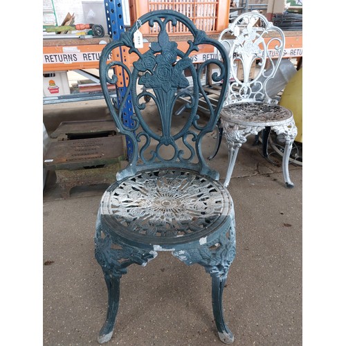 6168 - A green painted cast alloy garden chair.