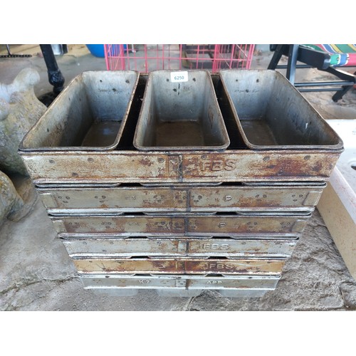 6250 - Six bread baking moulds which holds 3 loaves in each mould.