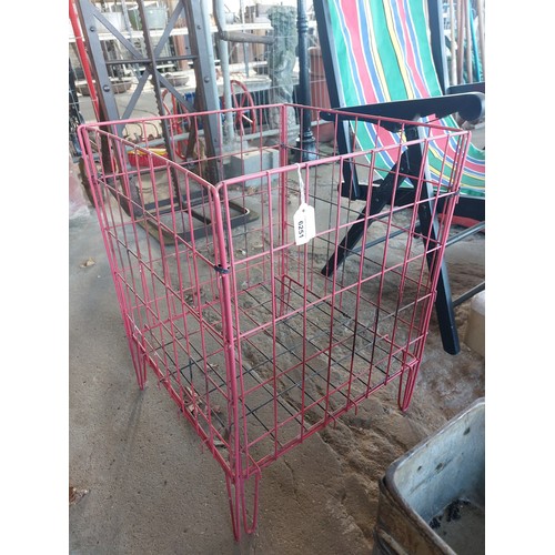 6251 - A red metal mesh storage basket, measuring 61cm high  and 44cm square.
