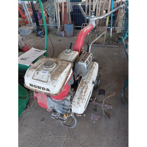 6264 - A Honda F400 Rotavator with attachments.