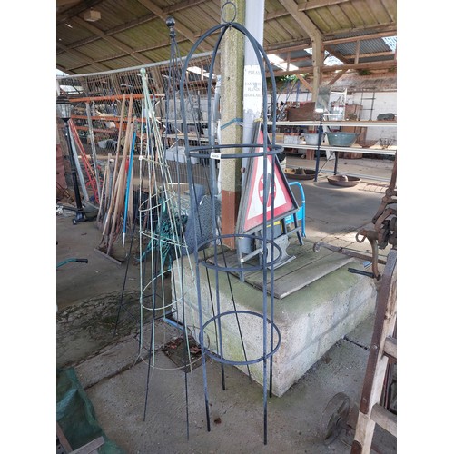 6269 - A black painted metal obelisk.