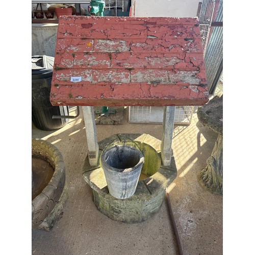 6280 - A concrete wishing well, measuring 108cm high x 59cm wide.