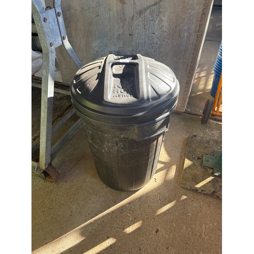 6283 - A black plastic dustbin.
