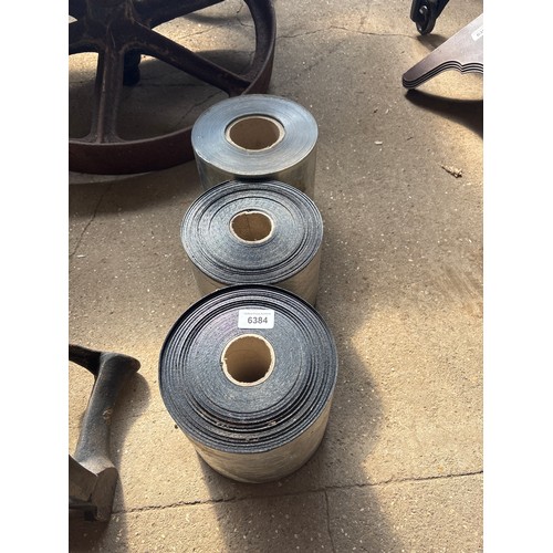 6384 - Three rolls of damp proof course.