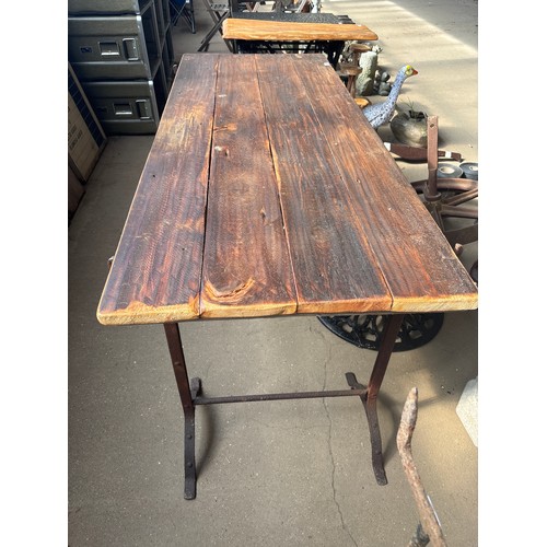 6386 - A vintage trestle table on vintage cast iron trestles. The top measures 182cm long x 72cm wide. The ... 