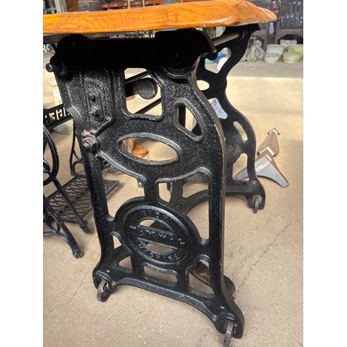 6397 - A cast iron mangle base with wooden top, measuring 78cm tall and 92cm long.