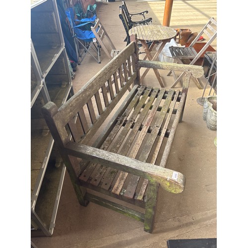 6409 - A teak wooden garden bench, measuring 130cm wide, 68cm deep and back measures 82cm tall.