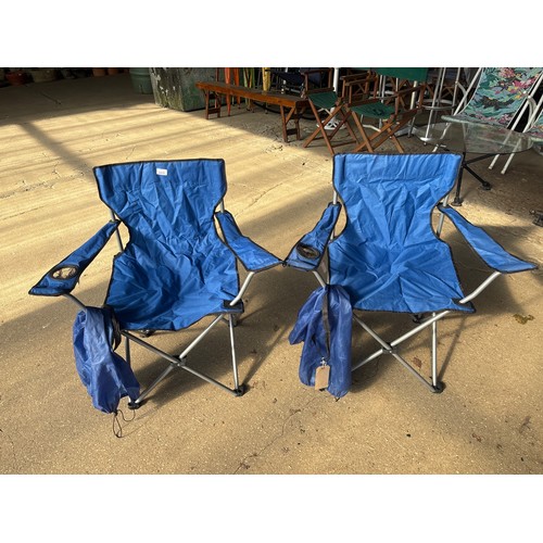 6415 - A pair of blue camping chairs in bag.