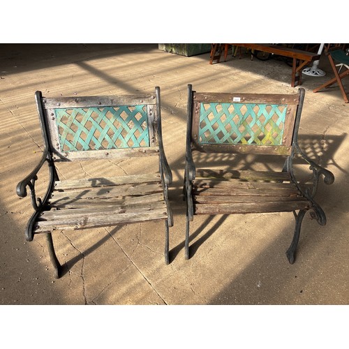 6417 - Two cast iron garden chairs with wooden slats.