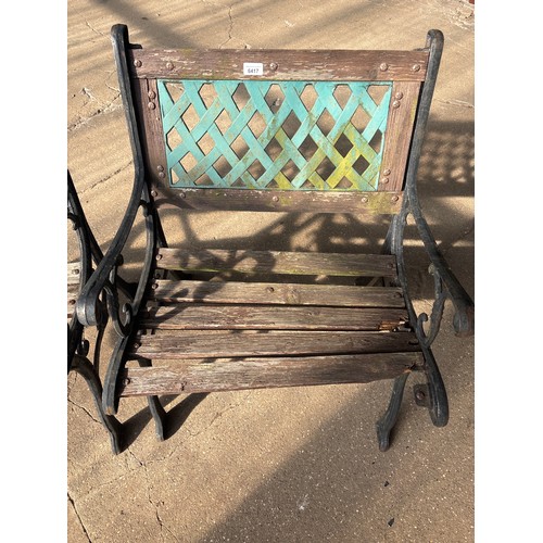 6417 - Two cast iron garden chairs with wooden slats.