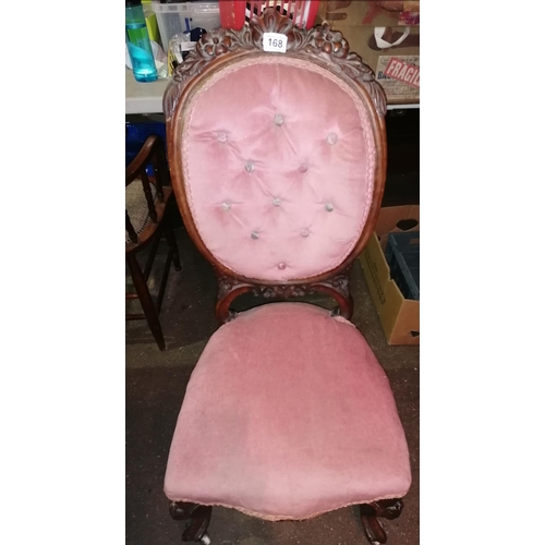263 - A Victorian mahogany buttonback Salon chair with carved top rail, carved cabriole legs, upholstered ... 