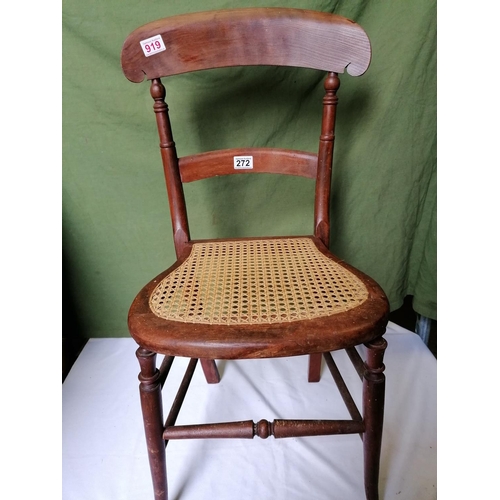 272 - A cane seated country chair with turned legs, stretcher and uprights