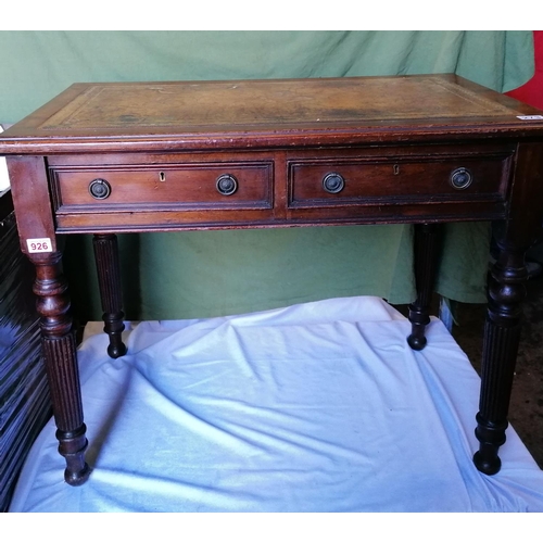 273 - Early 20C mahogany flat top writing table with leather top and two drawers, turned legs. H73 L90 D53... 